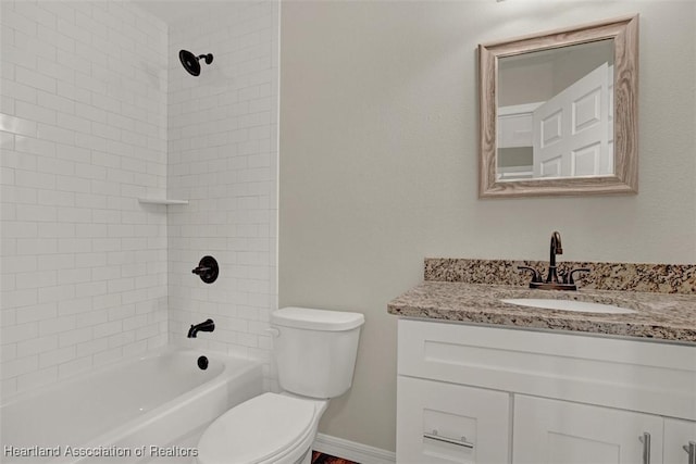 full bathroom featuring vanity, toilet, and tiled shower / bath