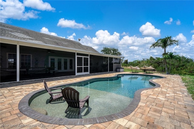 509 Bear Rd, Lake Placid, FL 33852 - swimming pool featuring a patio, a sunroom, ceiling fan, and french doors