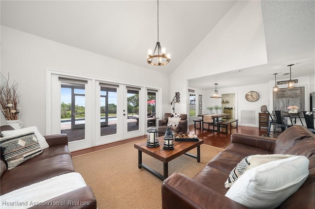 509 Bear Rd, Lake Placid, FL 33852 - living room with a chandelier, french doors, and high vaulted ceiling