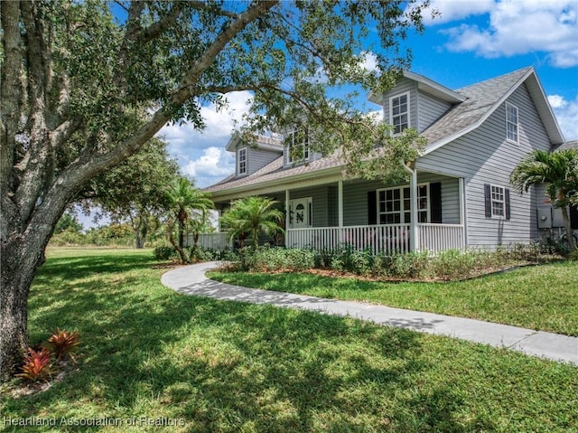 509 Bear Rd, Lake Placid, FL 33852 - view of front of property featuring a porch, a front lawn, and roof with shingles