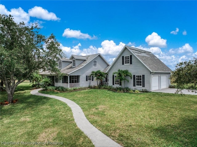 509 Bear Rd, Lake Placid, FL 33852 - view of front of property featuring a front yard, concrete driveway, a garage, a porch, and roof with shingles