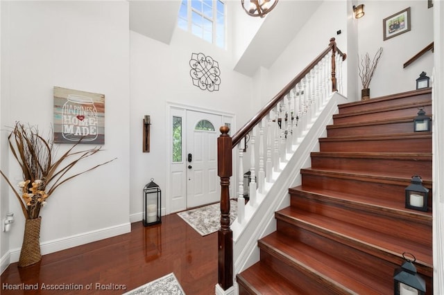 509 Bear Rd, Lake Placid, FL 33852 - entryway with stairway, wood finished floors, baseboards, and a high ceiling