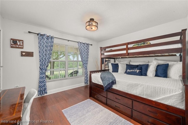 509 Bear Rd, Lake Placid, FL 33852 - bedroom with baseboards and dark wood finished floors