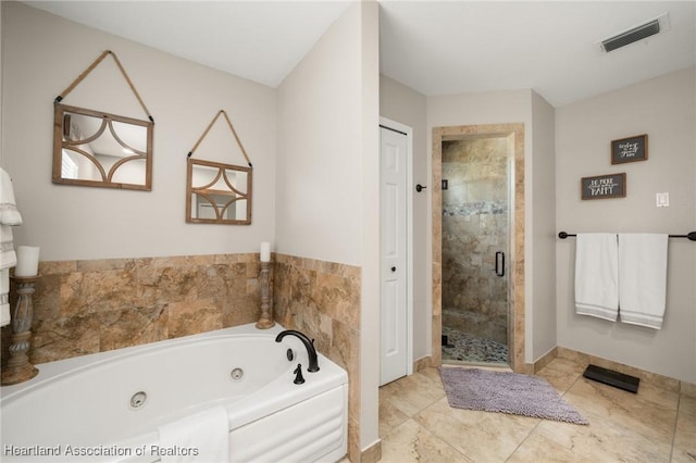 509 Bear Rd, Lake Placid, FL 33852 - bathroom featuring a tub with jets, a stall shower, and baseboards