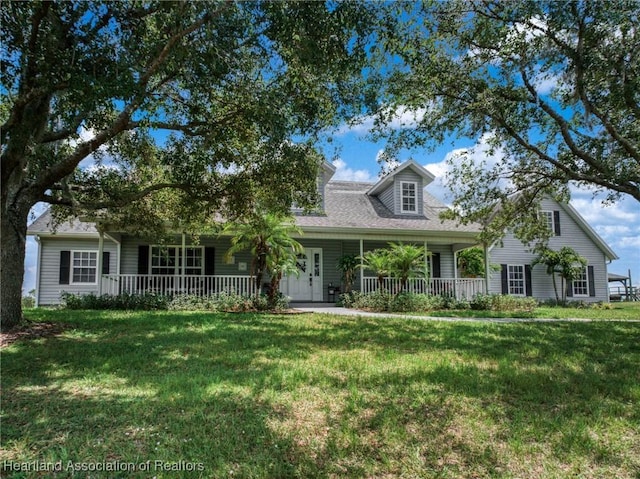 509 Bear Rd, Lake Placid, FL 33852 - view of front of house featuring covered porch and a front lawn
