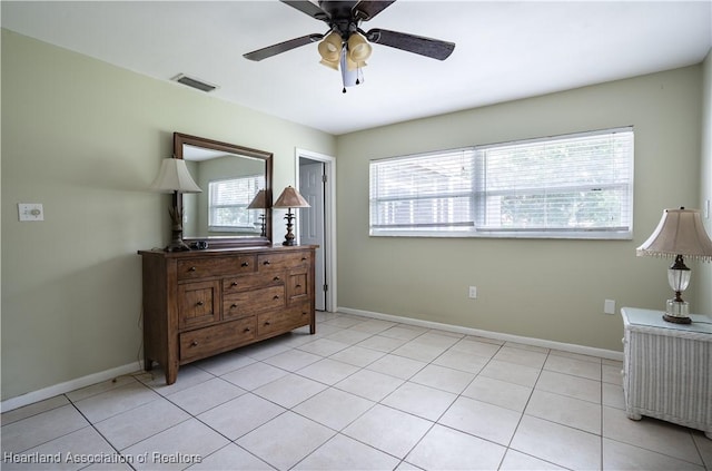 400 Spring Blvd, Sebring, FL 33876 - bedroom with baseboards, light tile patterned floors, and ceiling fan