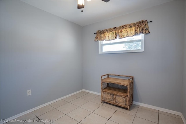 400 Spring Blvd, Sebring, FL 33876 - empty room featuring a ceiling fan, light tile patterned floors, and baseboards