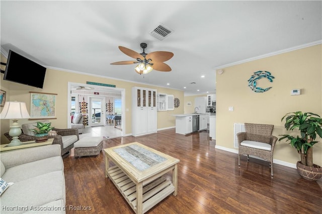 living room featuring crown molding, ceiling fan, dark hardwood / wood-style floors, and sink