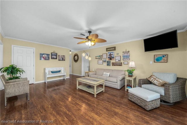 living room with crown molding, ceiling fan, and dark wood-type flooring