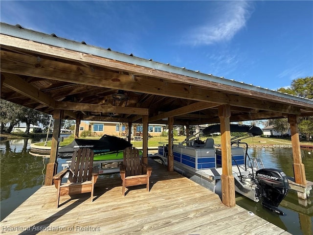 dock area with a water view