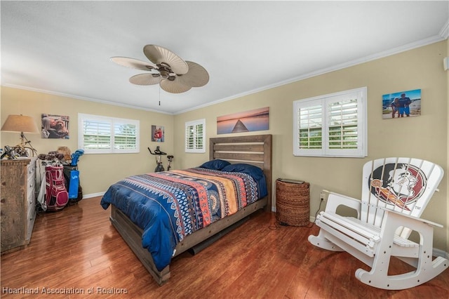 bedroom with ceiling fan, ornamental molding, dark hardwood / wood-style flooring, and multiple windows