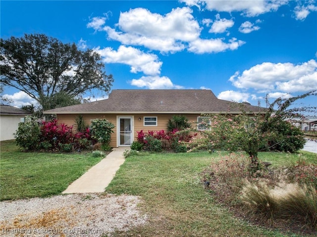 ranch-style house with a front yard