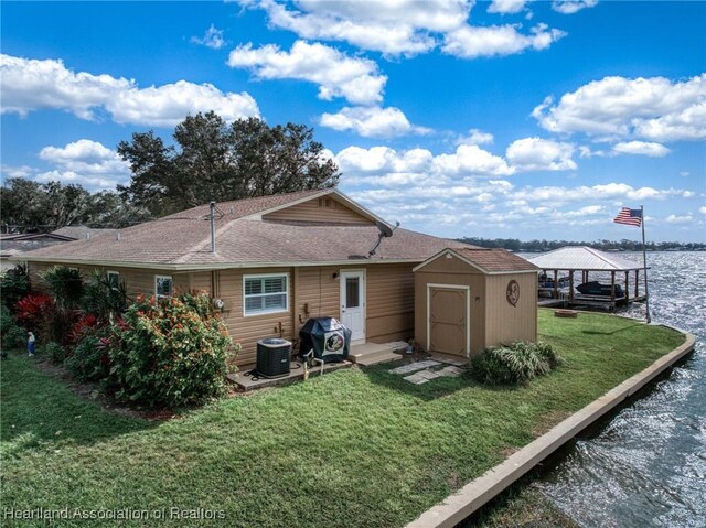 view of dock featuring a water view and a gazebo