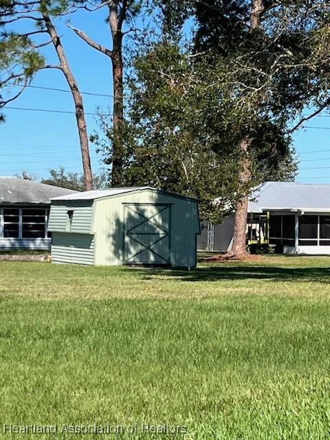 view of outbuilding with a lawn