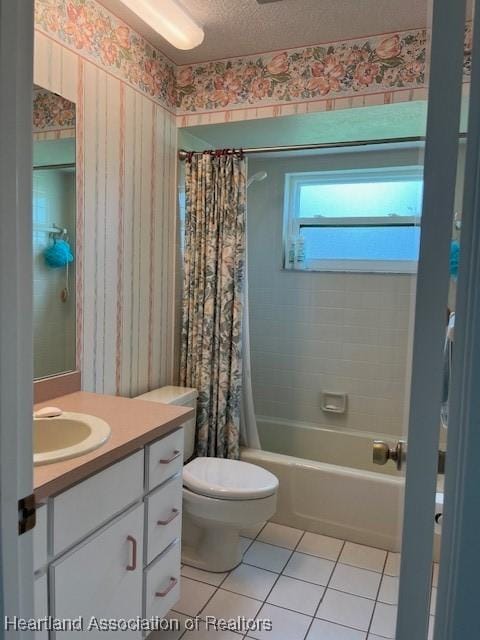 full bathroom featuring tile patterned flooring, a textured ceiling, toilet, shower / tub combo with curtain, and vanity