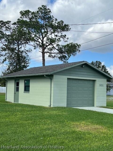 garage with a lawn