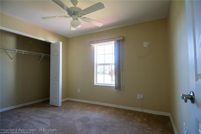 unfurnished bedroom featuring ceiling fan, light carpet, and a closet