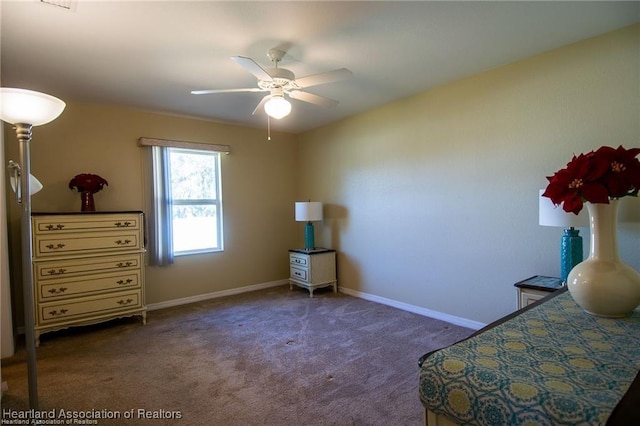 bedroom with ceiling fan and dark colored carpet