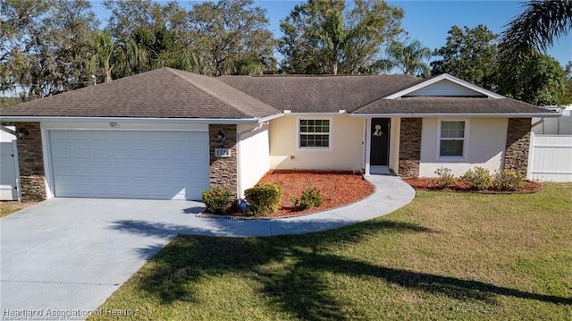 ranch-style home with a front yard and a garage