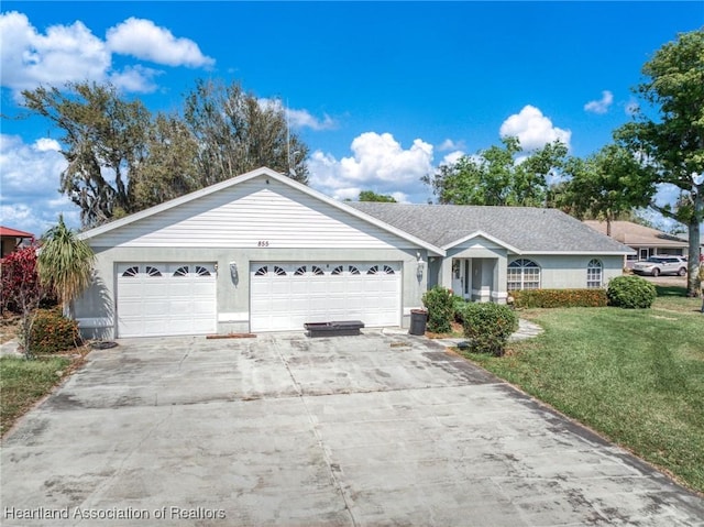 single story home with a garage, driveway, a front lawn, and stucco siding