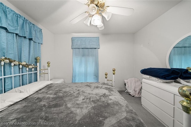 bedroom with ceiling fan and carpet floors