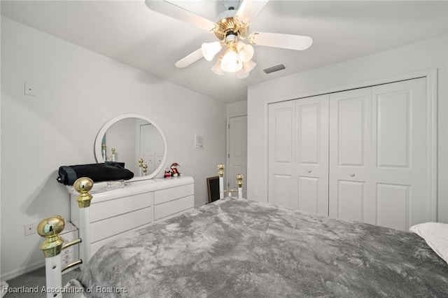 bedroom featuring a closet, visible vents, and ceiling fan