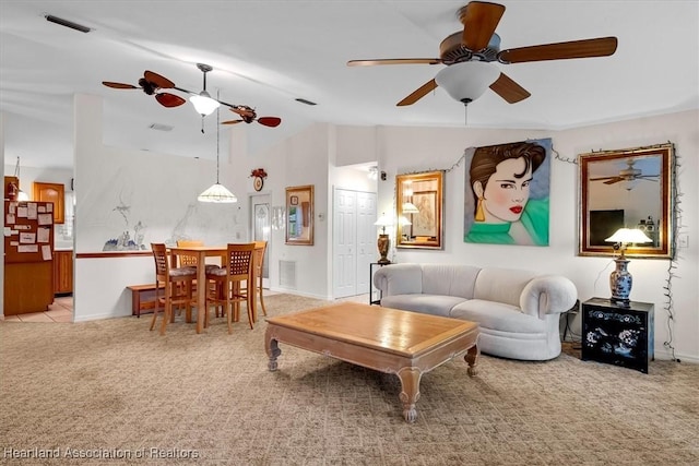 living room featuring light carpet and vaulted ceiling