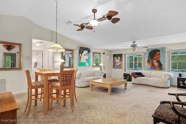 carpeted living room featuring vaulted ceiling and ceiling fan