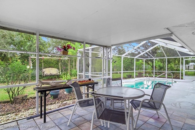 exterior space featuring a swimming pool and a healthy amount of sunlight