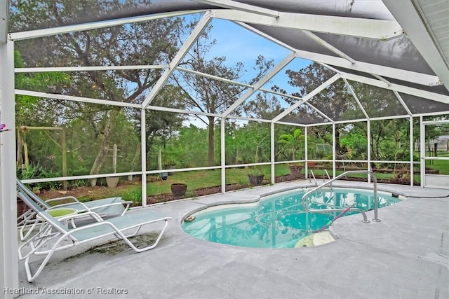 view of pool featuring a patio and a lanai