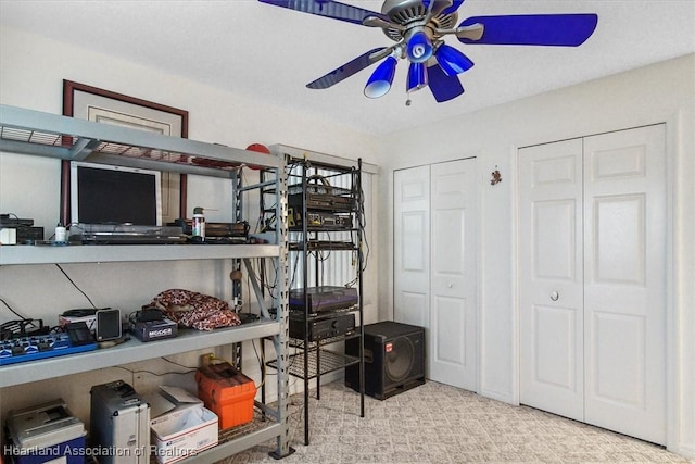 storage area featuring ceiling fan