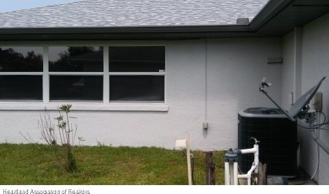 view of property exterior featuring central AC unit