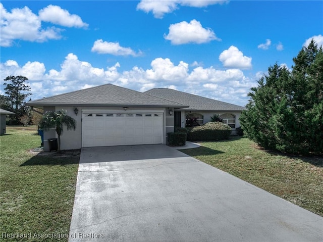 ranch-style home with a garage and a front lawn