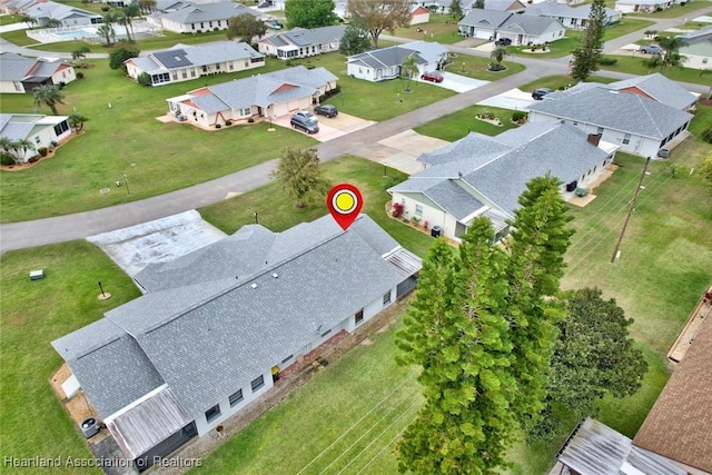 birds eye view of property with a residential view