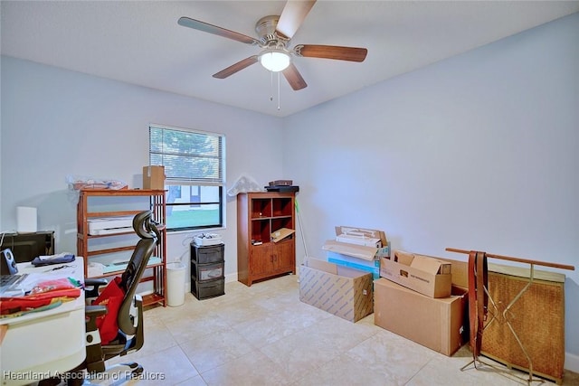 office featuring ceiling fan and baseboards