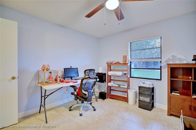 office featuring ceiling fan and baseboards