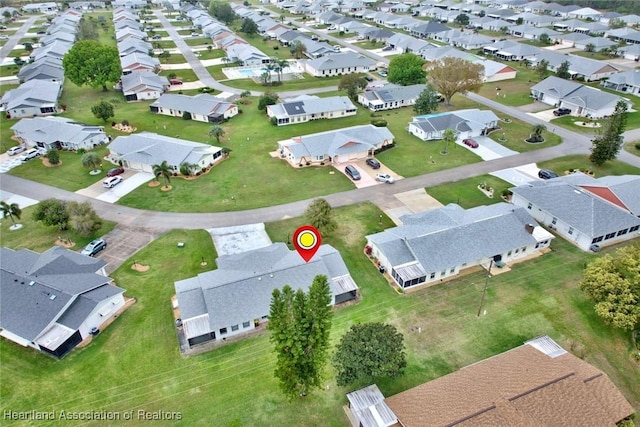 birds eye view of property with a residential view