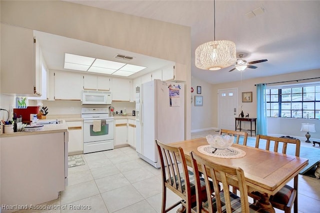 dining area with visible vents, ceiling fan, baseboards, and light tile patterned floors