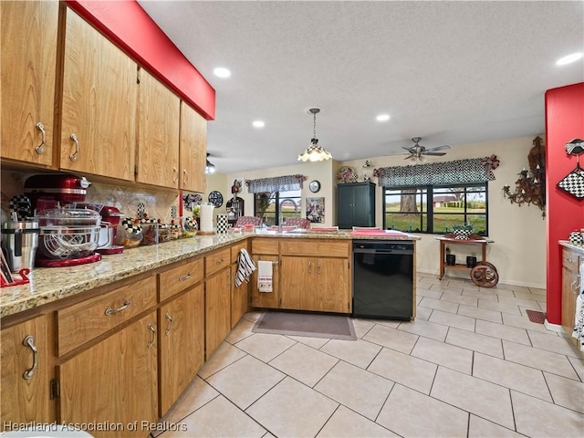 kitchen with kitchen peninsula, black dishwasher, ceiling fan, and sink