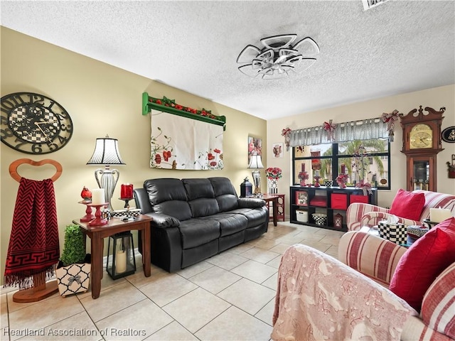 living room featuring light tile patterned floors and a textured ceiling