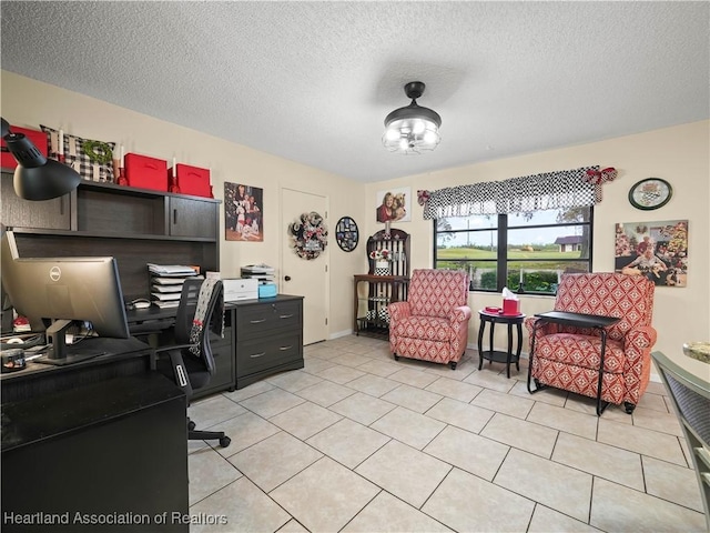 tiled home office featuring a textured ceiling