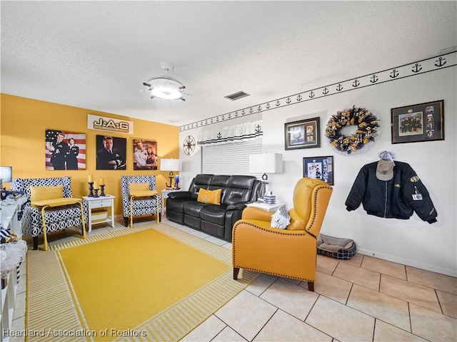 living room featuring light tile patterned floors and a textured ceiling