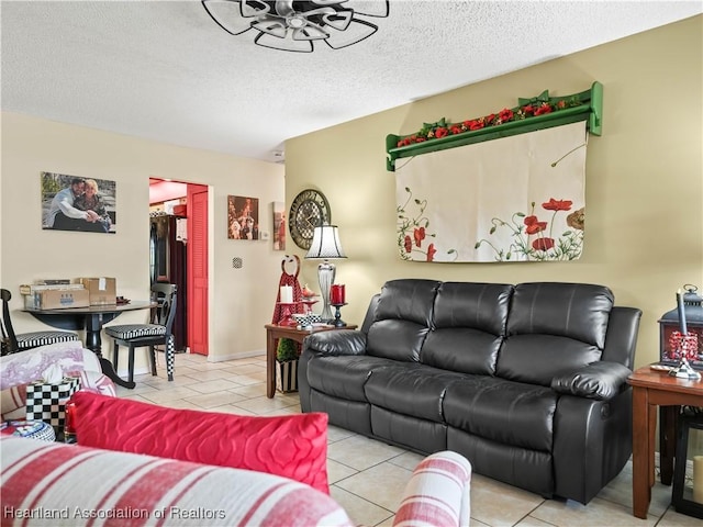 living room with light tile patterned floors and a textured ceiling