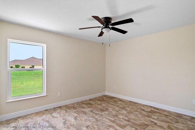 empty room featuring ceiling fan