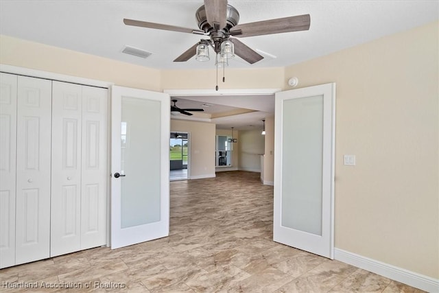 interior space featuring french doors, a closet, and ceiling fan