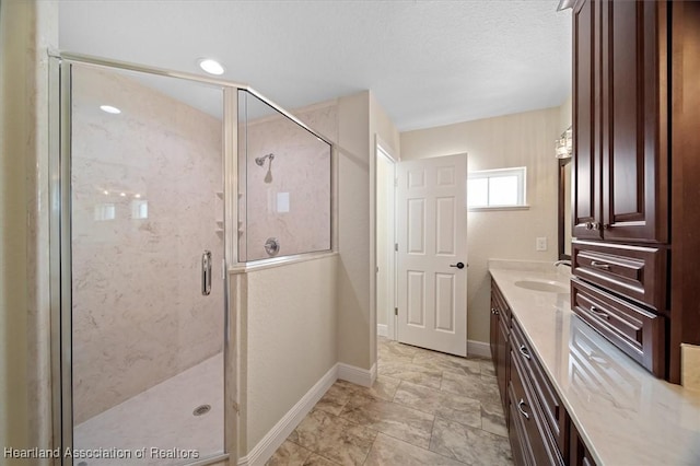 bathroom with vanity and an enclosed shower