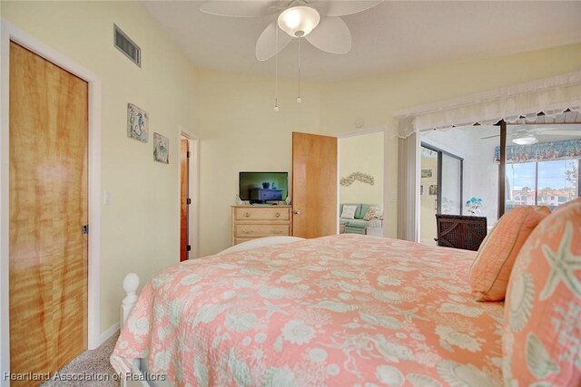 carpeted bedroom featuring access to outside and ceiling fan