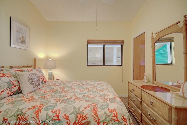 carpeted bedroom featuring ceiling fan