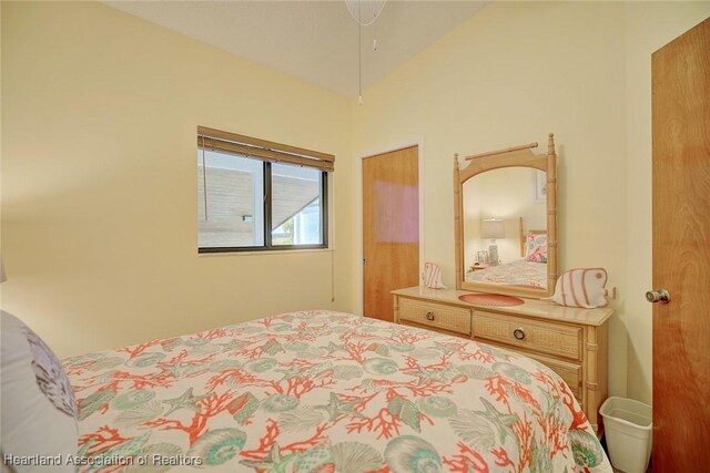 bedroom with vaulted ceiling