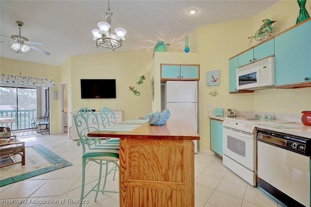 kitchen with ceiling fan with notable chandelier, light tile patterned flooring, hanging light fixtures, and white appliances